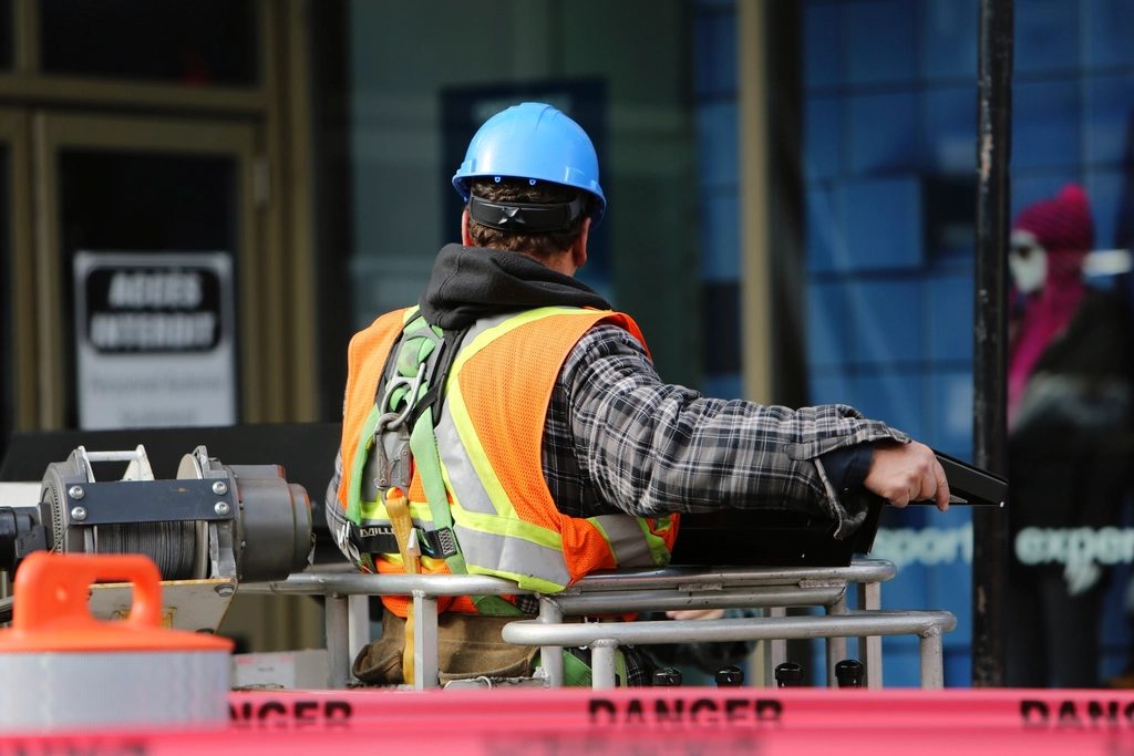 Crew member in a high-visibility vest working on site